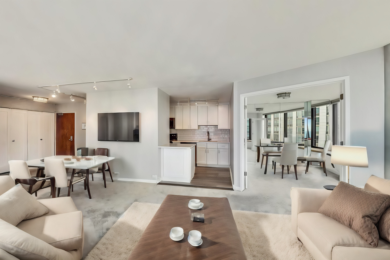 155 North Harbor Drive, Unit 4804 Chicago, IL 60601 - Photo 3 of 31 a living room with furniture and a flat screen tv