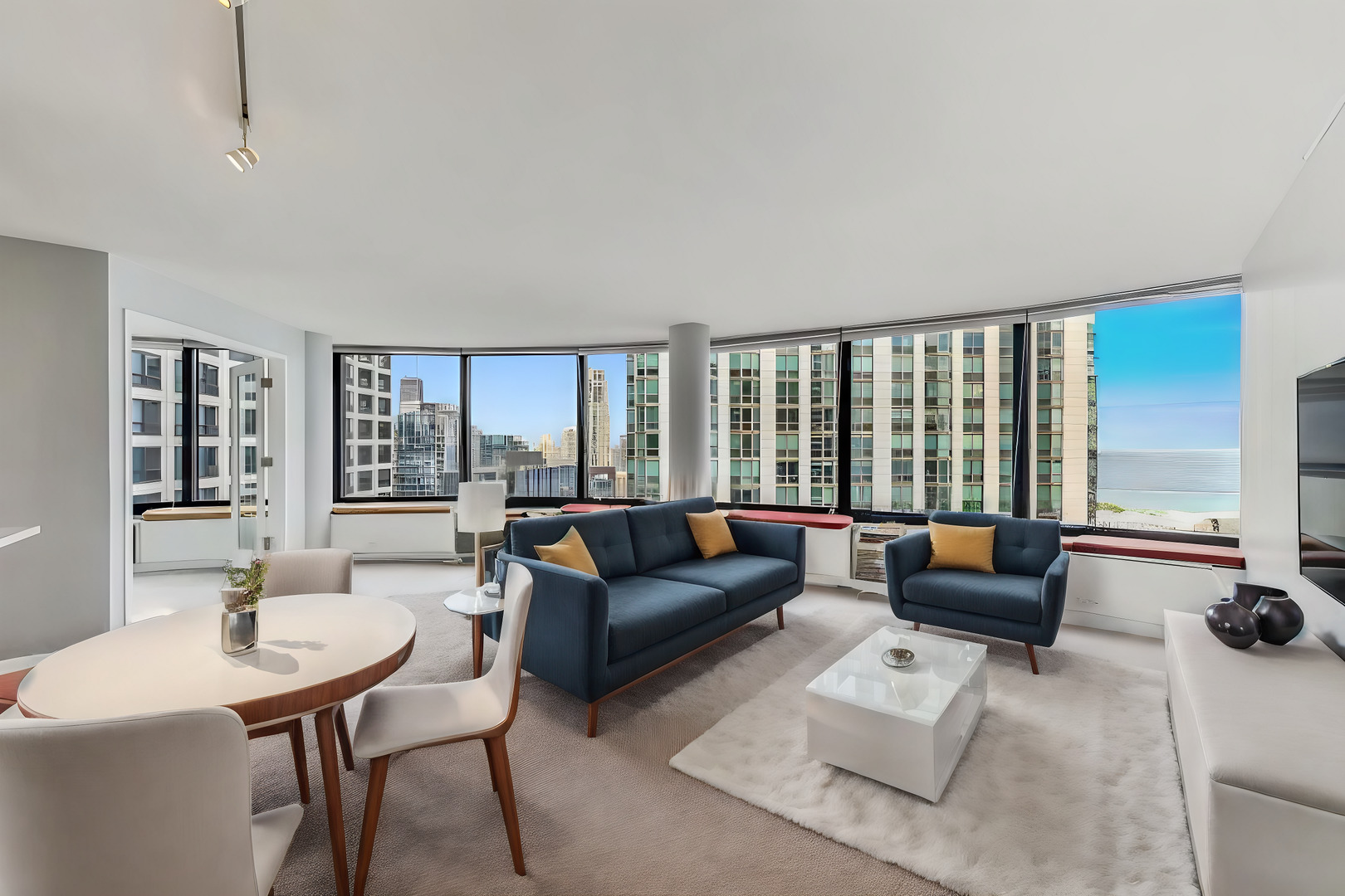 155 North Harbor Drive, Unit 4804 Chicago, IL 60601 - Photo 4 of 31 a living room with furniture and a large window