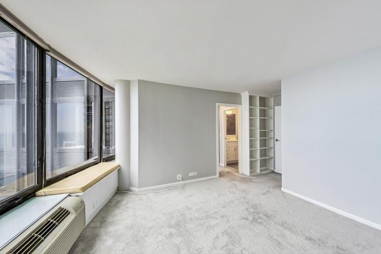 155 North Harbor Drive, Unit 4804 Chicago, IL 60601 - Photo 9 of 31 an empty room with windows