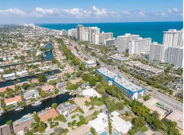 an aerial view of residential houses with outdoor space