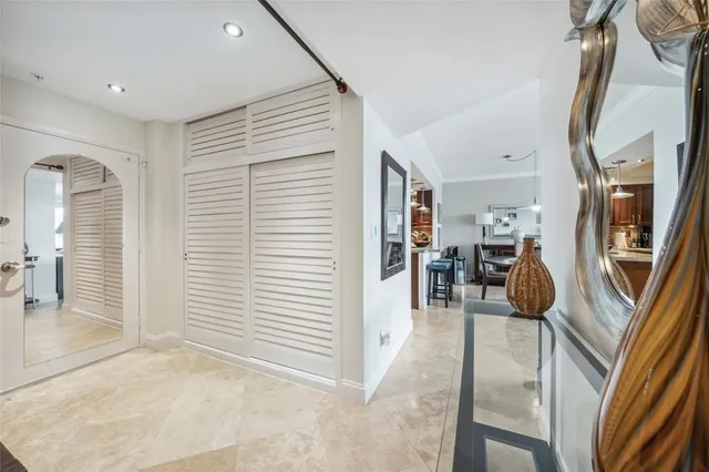 a kitchen with stainless steel appliances a sink a stove and cabinets