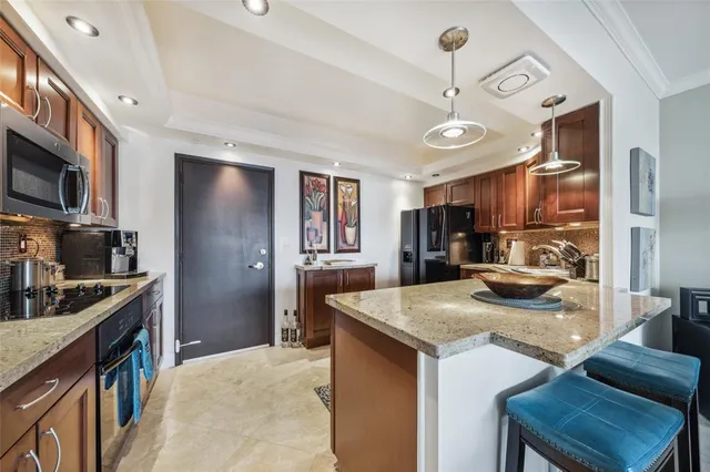 a kitchen with a refrigerator and a sink