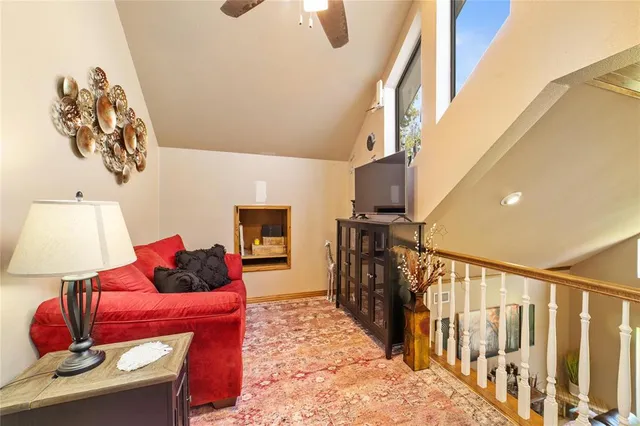 a living room with furniture and a rug