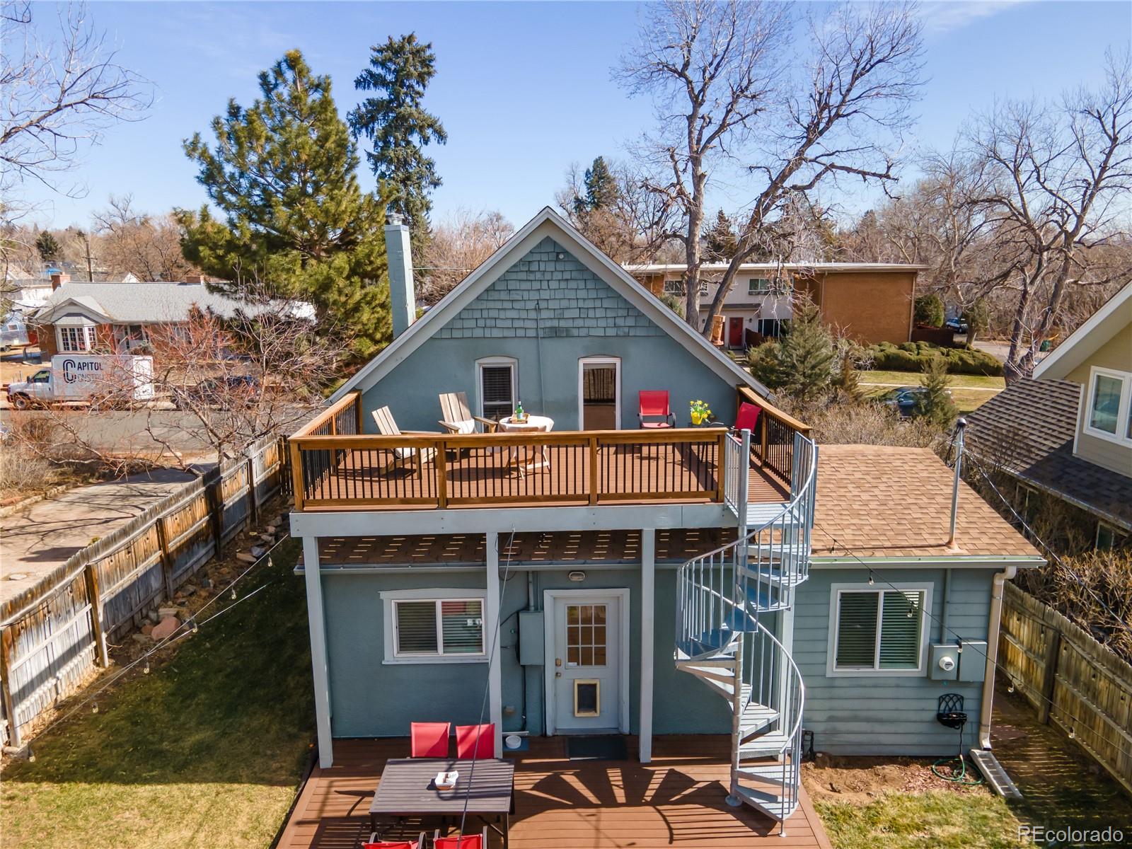 2819 Eaton Street Wheat Ridge, CO 80214 - Photo 4 of 38 a front view of a house with an outdoor space