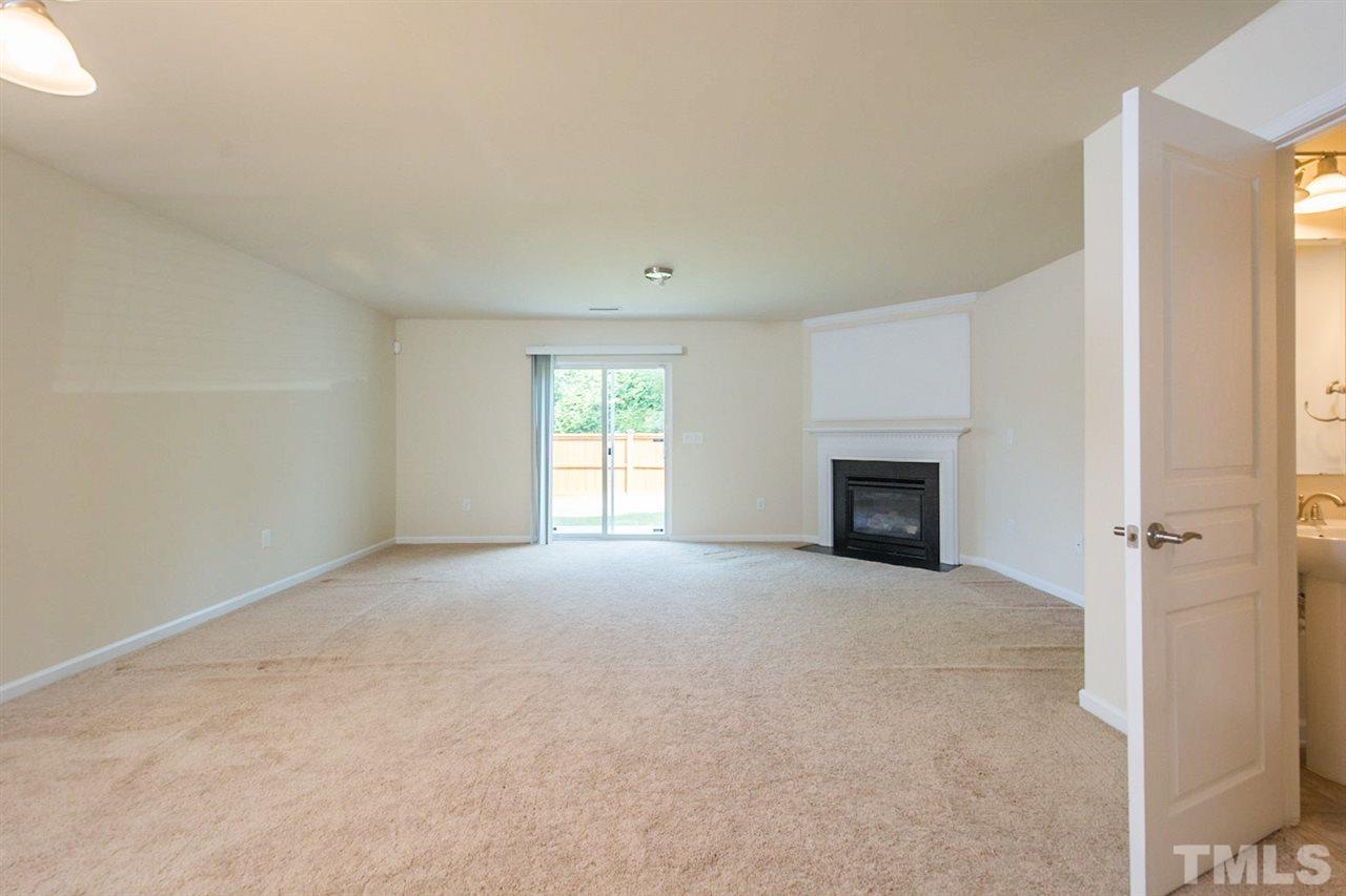 2926 Berkeley Springs Place Raleigh, NC 27616 - Photo 5 of 13 an empty room with windows