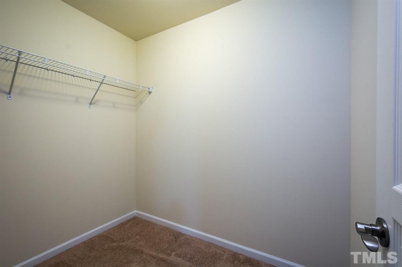 2926 Berkeley Springs Place Raleigh, NC 27616 - Photo 9 of 13 a view of a room with racks on the wall
