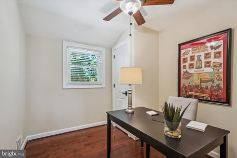 a view of a workspace with furniture