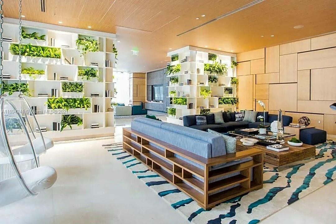 55 Southwest 9th Street, Unit 3209 Miami, FL 33130 - Photo 22 of 35 a living room with patio furniture and a fireplace