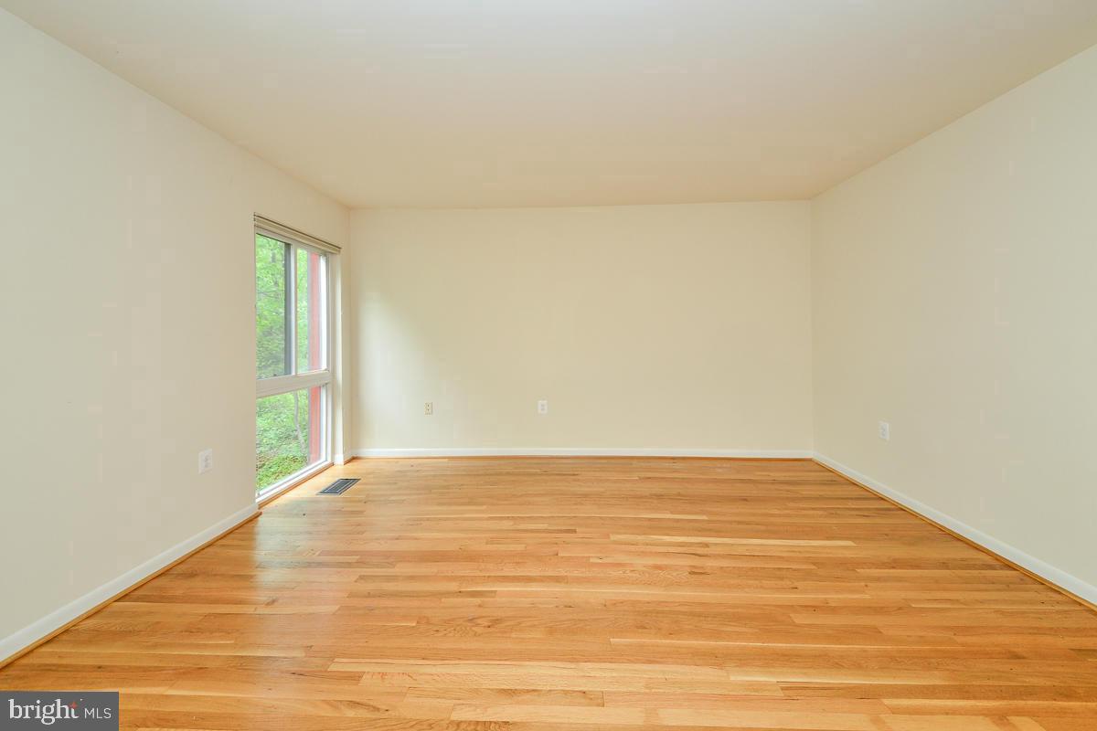 11187 Saffold Way Reston, VA 20190 - Photo 18 of 27 a view of an empty room and wooden floor