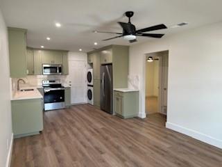 320 Ralph Street, Unit D White Settlement, TX 76108 - Photo 4 of 7 a kitchen with a refrigerator and a sink