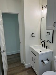 320 Ralph Street, Unit D White Settlement, TX 76108 - Photo 6 of 7 a bathroom with a sink and a mirror