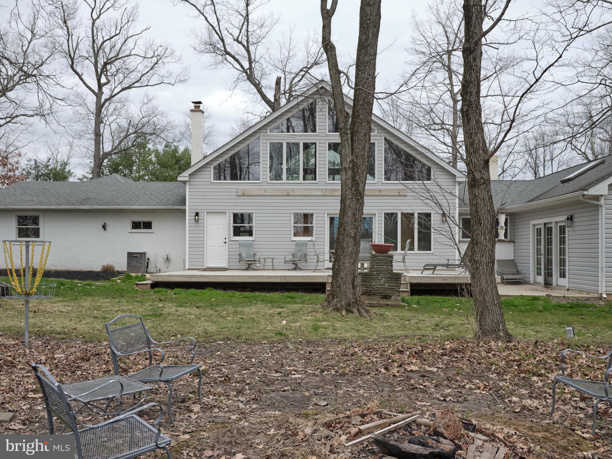 1296 Durham Road Buckingham, PA 18938 - Photo 3 of 13 a white house that has a tree in front of it