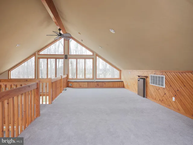 a view of an empty room with a balcony