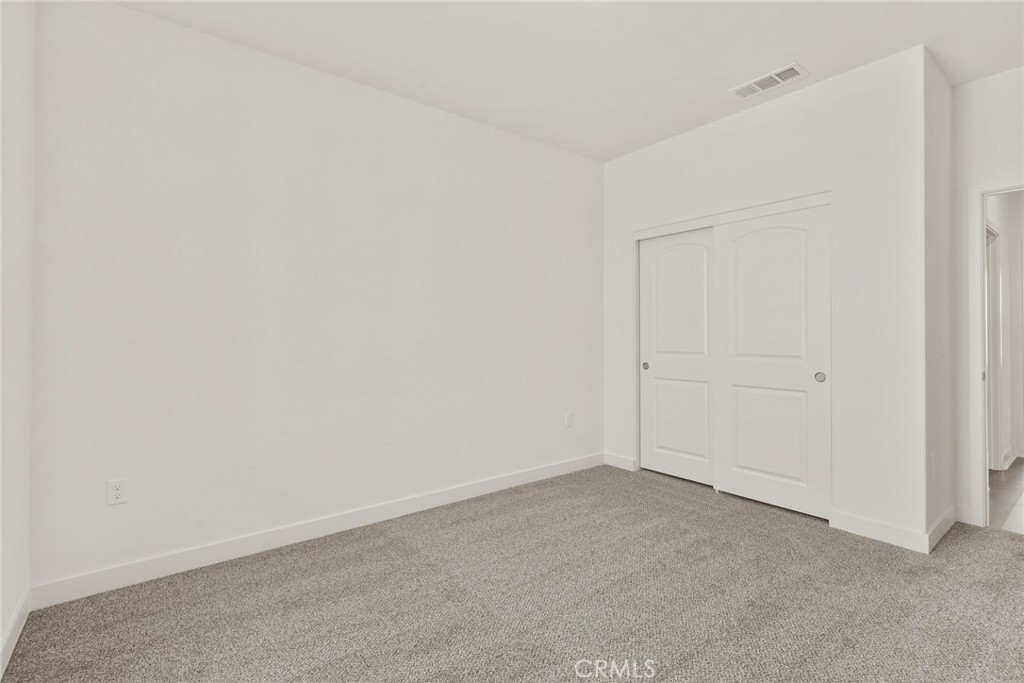 14574 Indigo Street Apple Valley, CA 92307 - Photo 5 of 6 an empty room with an empty space
