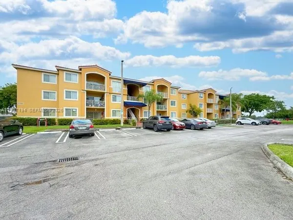 a view of a street with cars