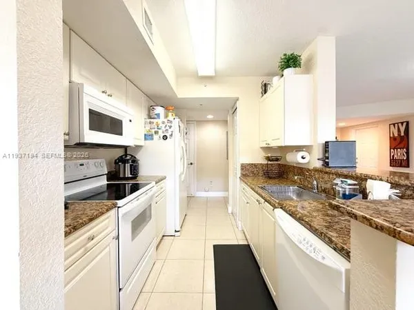 a large kitchen with a stove top oven