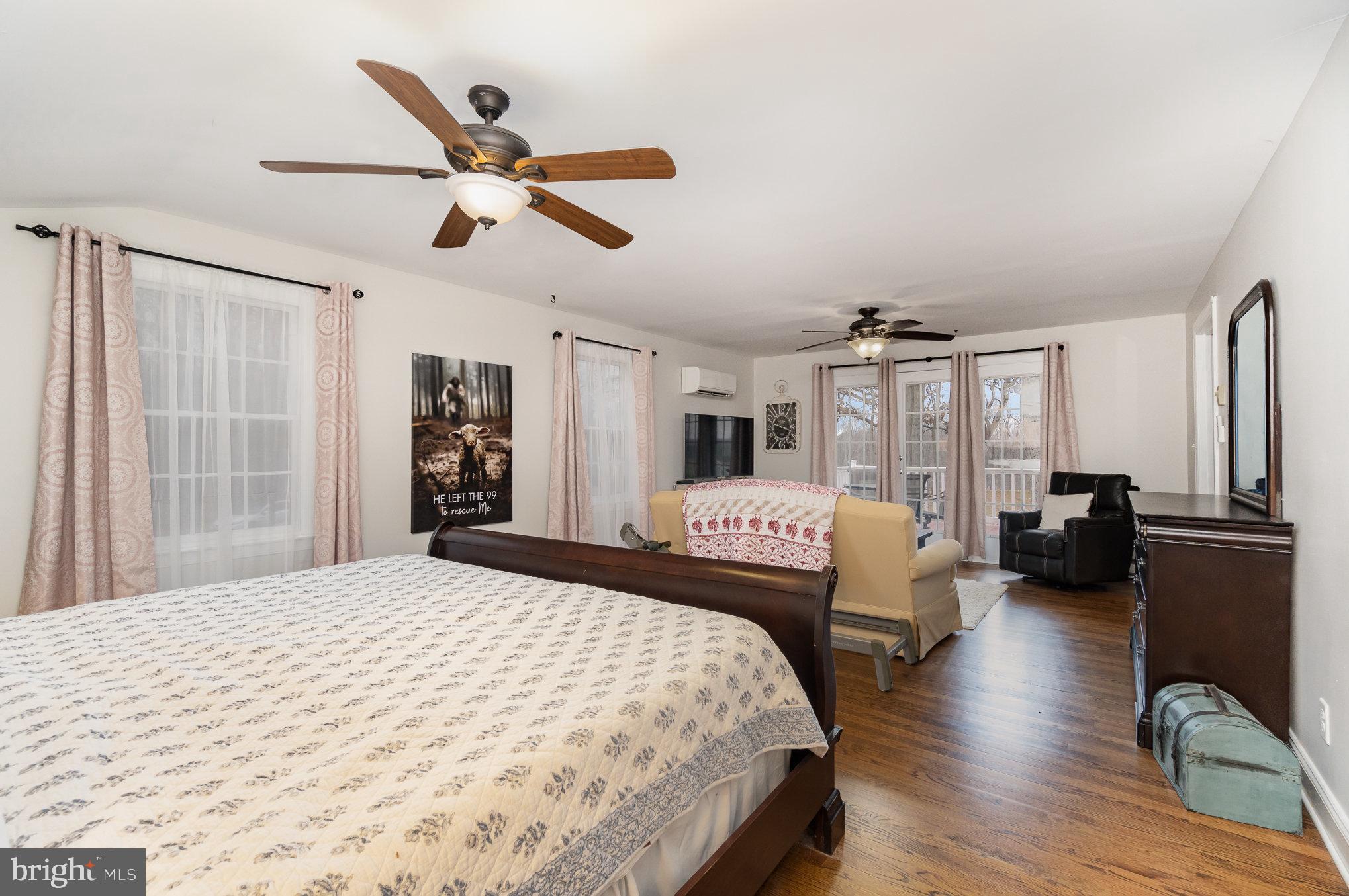 35 North Tannery Road Westminster, MD 21157 - Photo 17 of 47 a bedroom with a bed large window and a chandelier