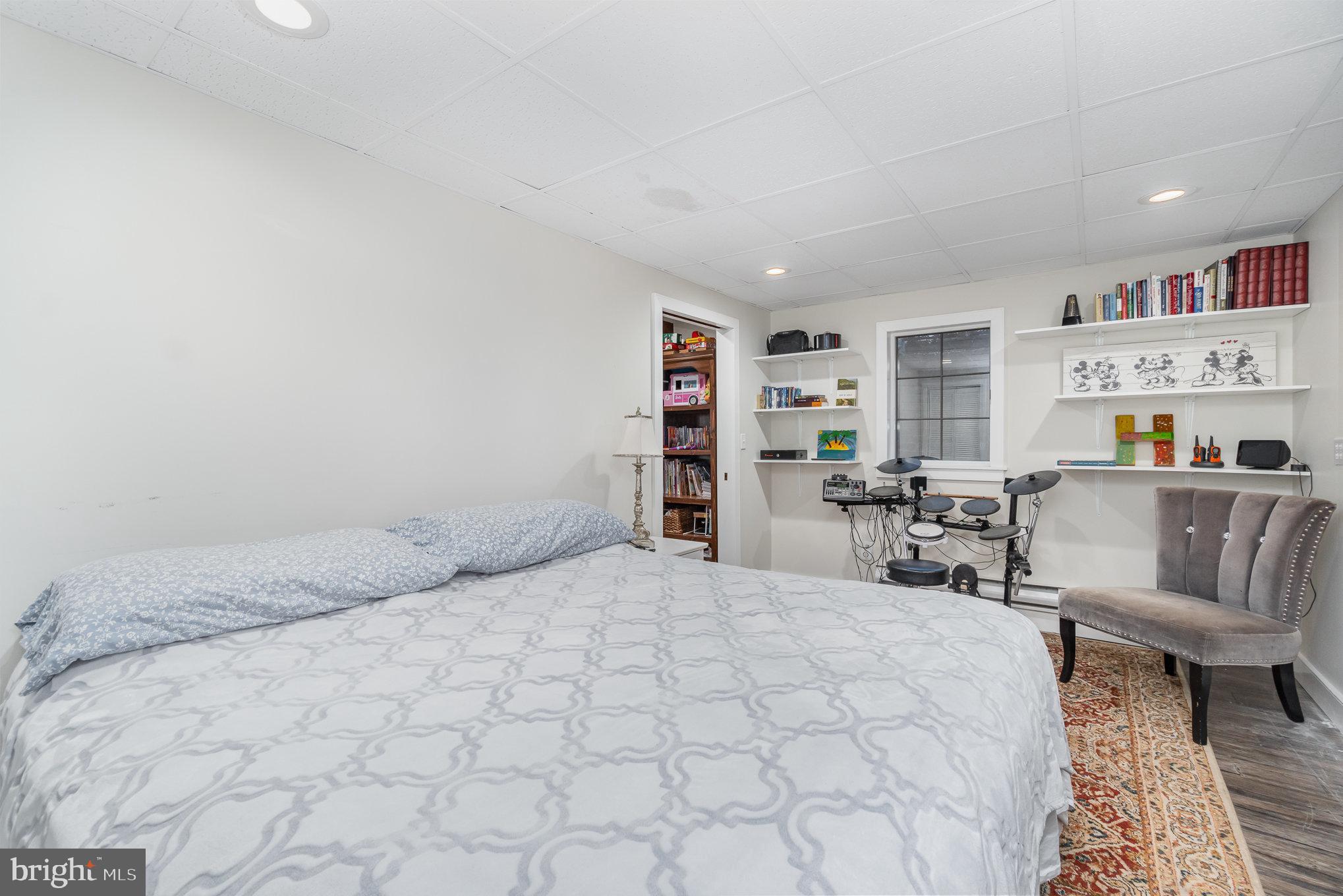 35 North Tannery Road Westminster, MD 21157 - Photo 26 of 47 a bedroom with a large bed and a book shelf