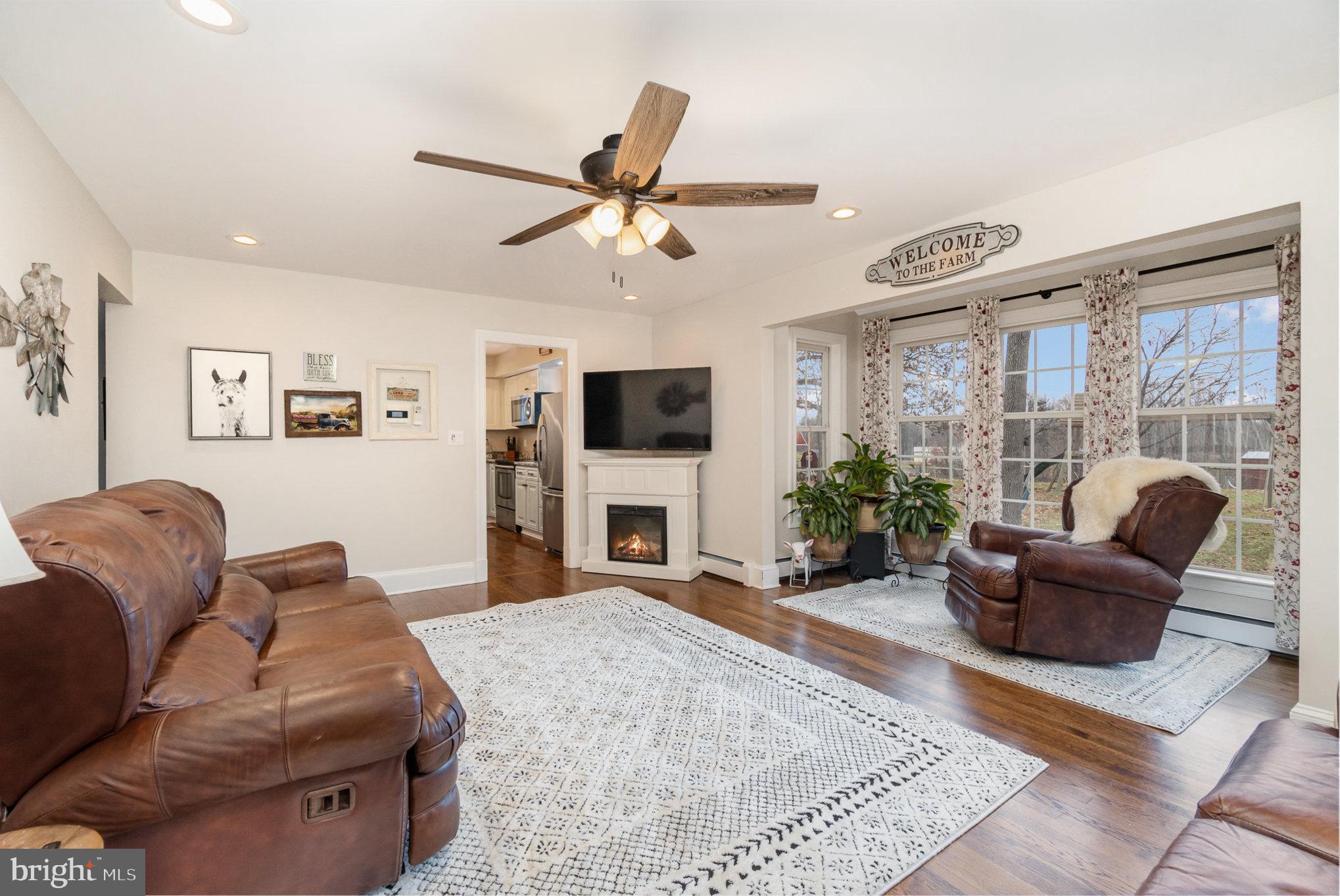 35 North Tannery Road Westminster, MD 21157 - Photo 9 of 47 a living room with furniture a flat screen tv and a large window