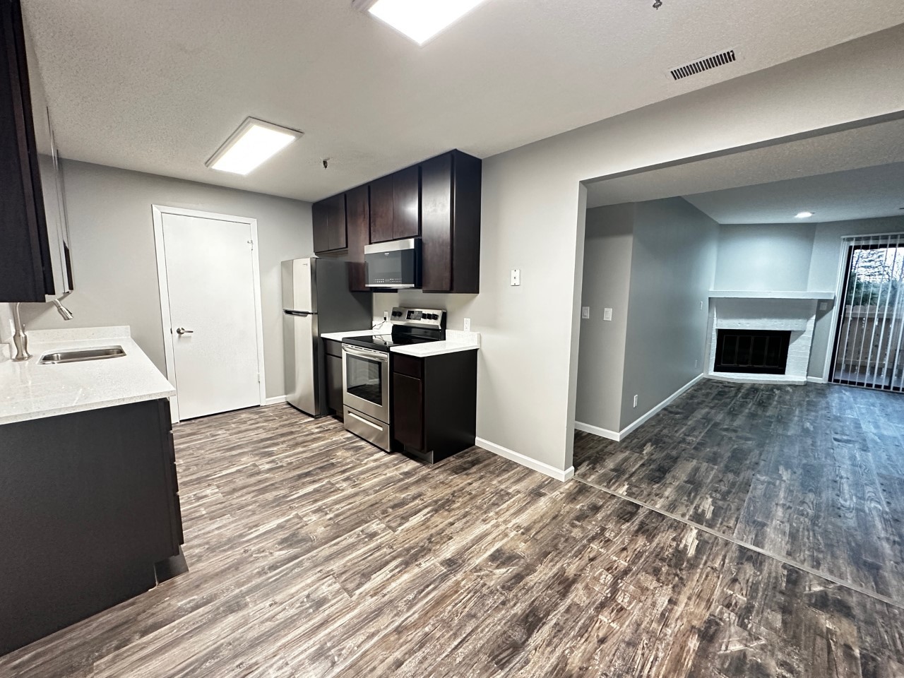 1340 Brook Street, Unit J St. Charles, IL 60174 - Photo 3 of 11 a view of kitchen with sink microwave and refrigerator