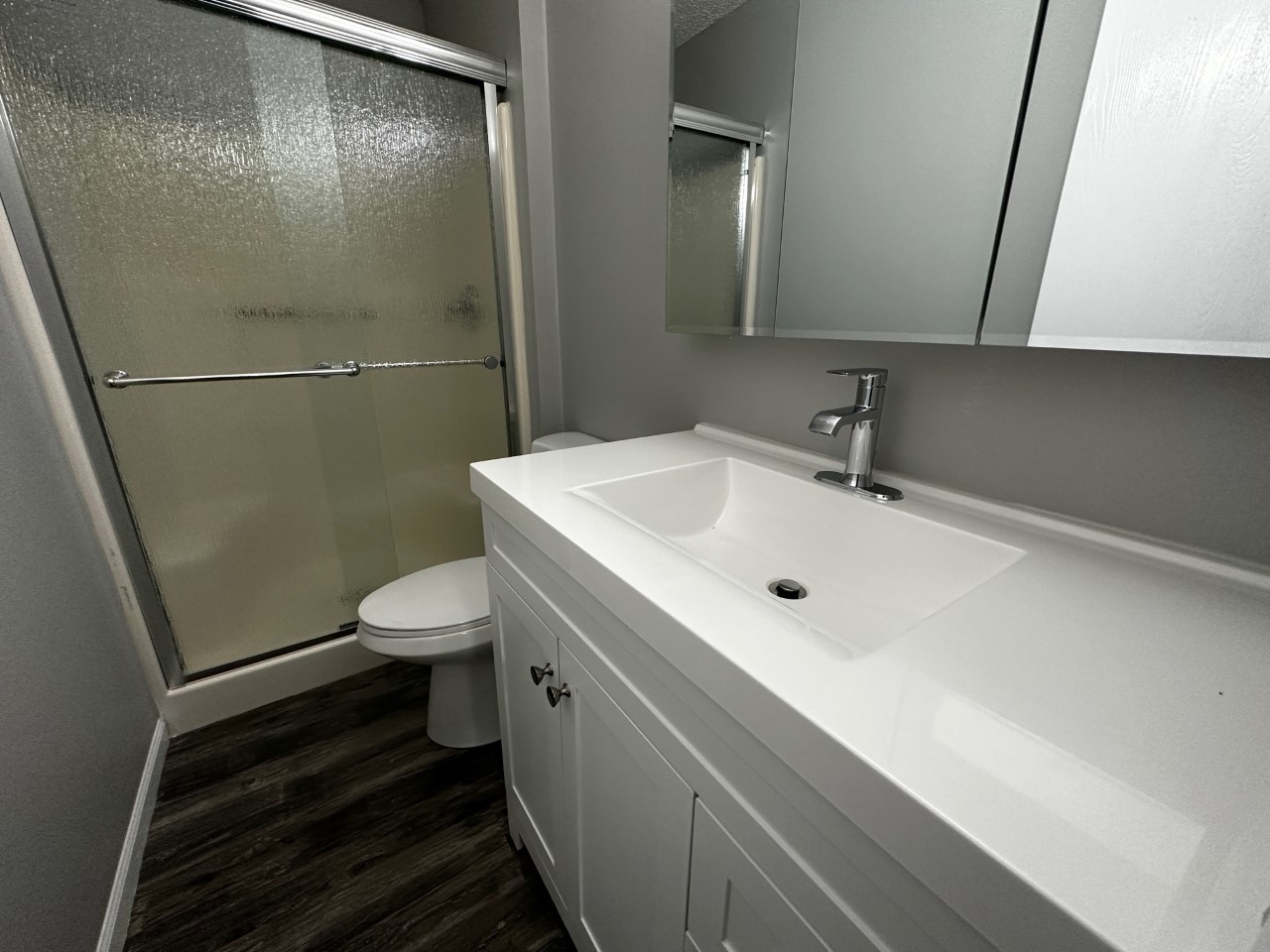 1340 Brook Street, Unit J St. Charles, IL 60174 - Photo 6 of 11 a bathroom with a sink mirror toilet and shower