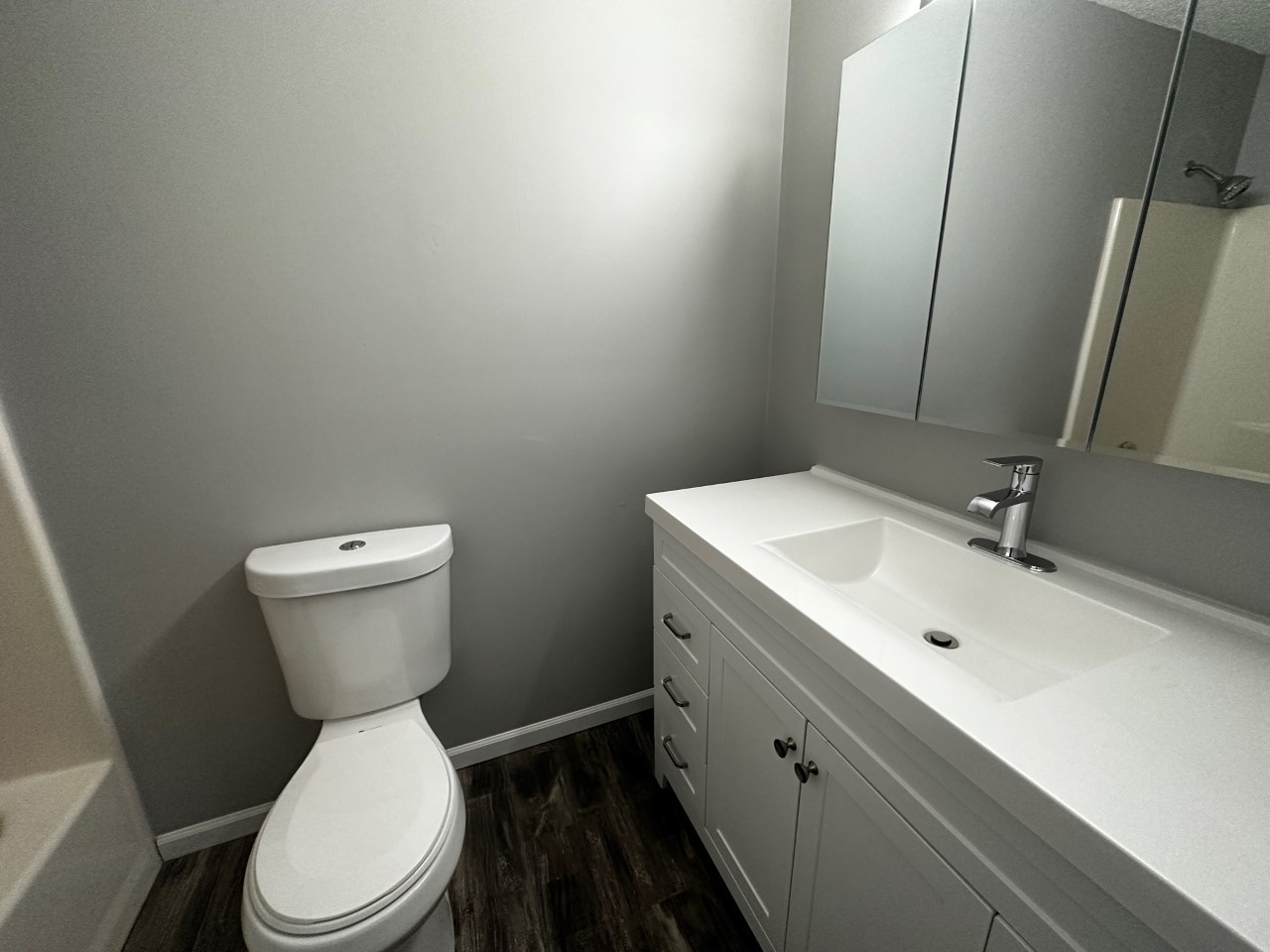 1340 Brook Street, Unit J St. Charles, IL 60174 - Photo 8 of 11 a bathroom with a toilet sink and mirror