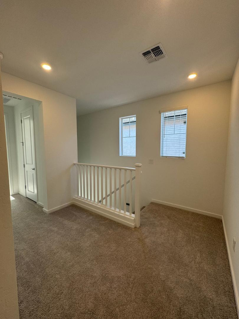 2442 West Maximo Way Phoenix, AZ 85085 - Photo 14 of 16 an empty room with windows