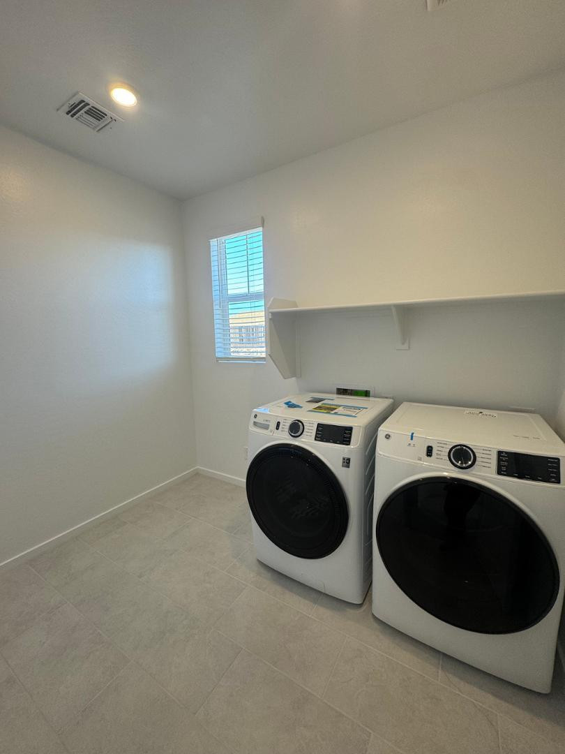 2442 West Maximo Way Phoenix, AZ 85085 - Photo 16 of 16 a view of a washer and dryer