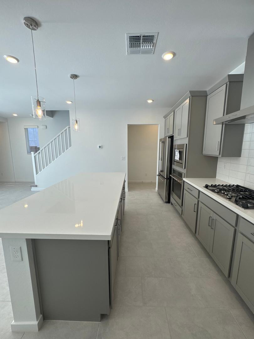 2442 West Maximo Way Phoenix, AZ 85085 - Photo 5 of 16 a kitchen with refrigerator and window