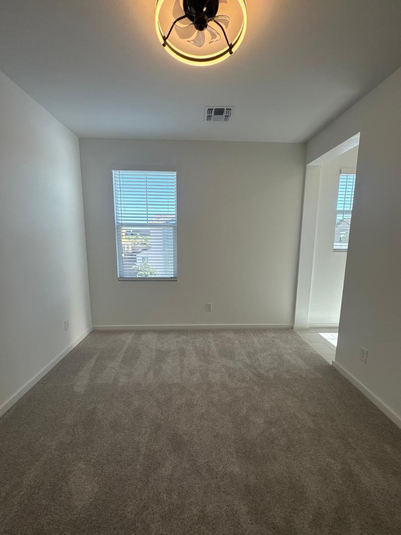 2442 West Maximo Way Phoenix, AZ 85085 - Photo 10 of 16 a view of an empty room and window