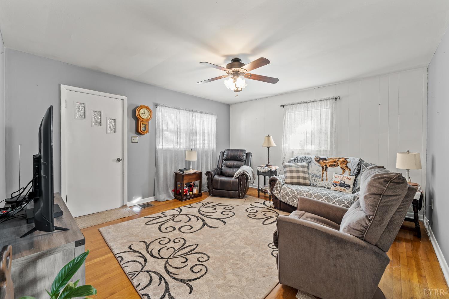 3169 Centerville Road Bedford, VA 24523 - Photo 14 of 25 a living room with furniture a ceiling fan and a window