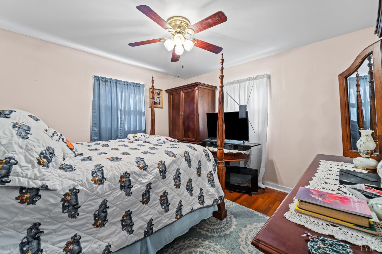 3169 Centerville Road Bedford, VA 24523 - Photo 17 of 25 a bedroom with bed and flat screen tv