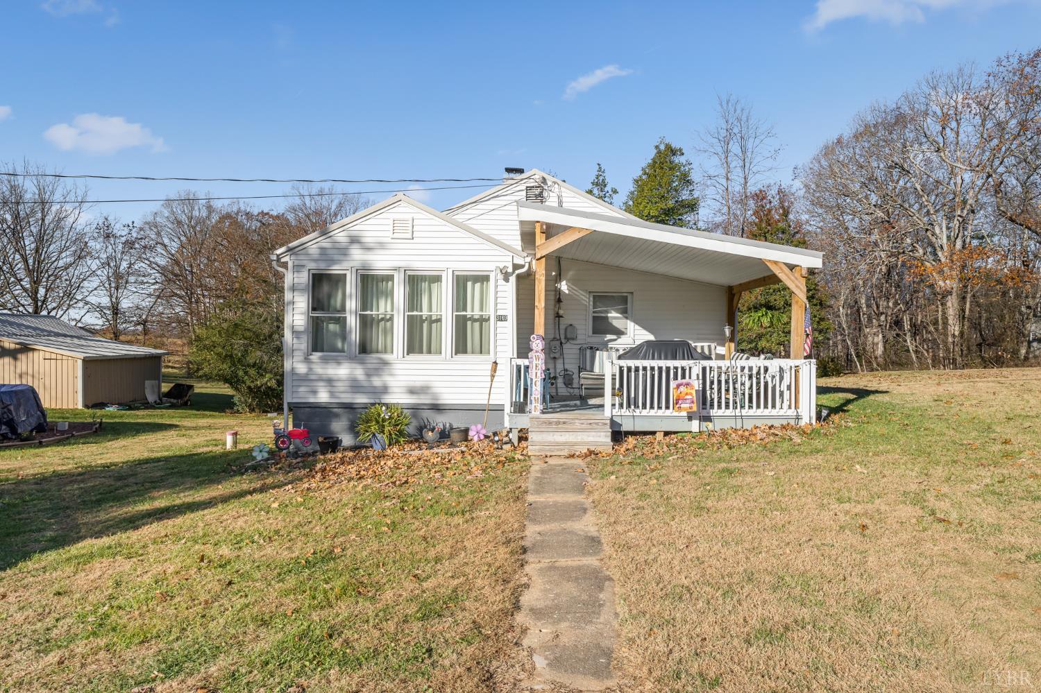 3169 Centerville Road Bedford, VA 24523 - Photo 3 of 25 a view of a house with a yard and potted plants