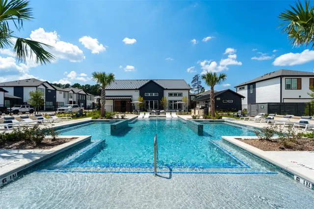 a view of a swimming pool with a patio