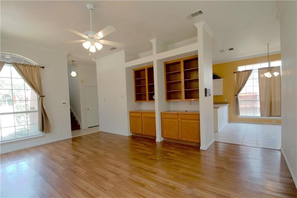 559 Raintree Circle Coppell, TX 75019 - Photo 12 of 18 a view of an empty room with wooden floor and a window