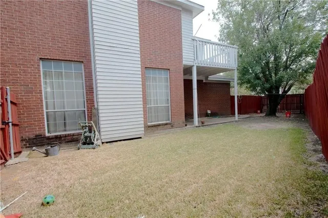 a view of a house with a yard and garage