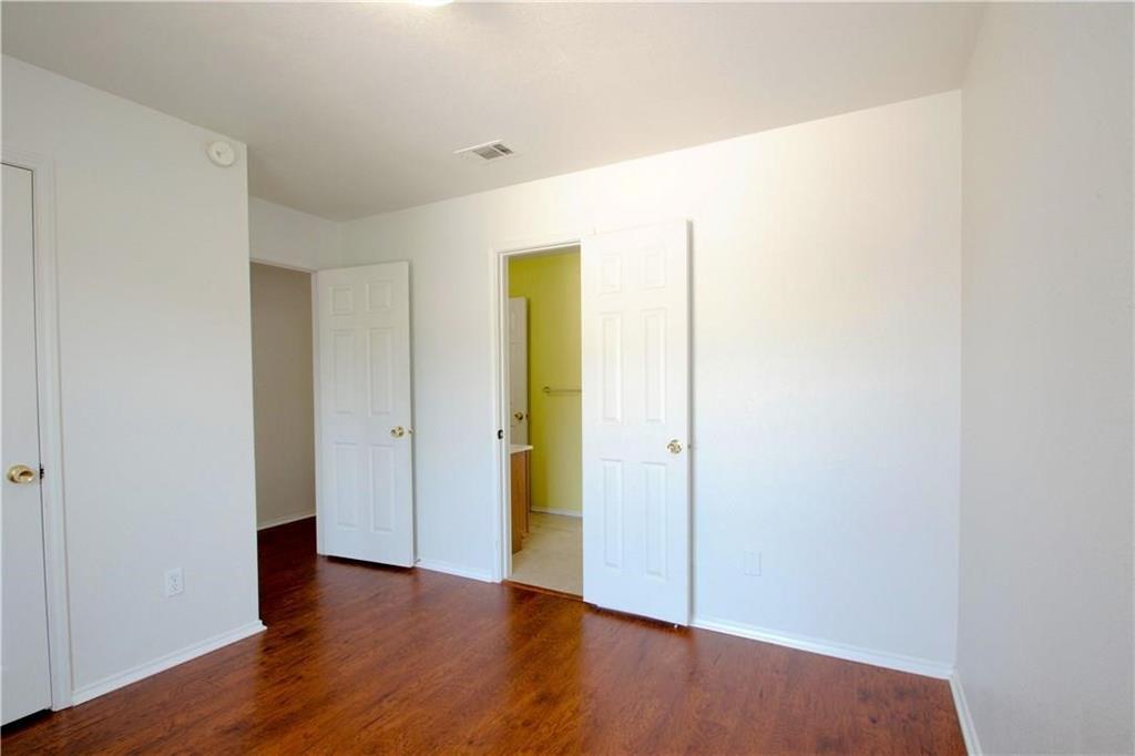 559 Raintree Circle Coppell, TX 75019 - Photo 18 of 18 a view of an empty room with wooden floor