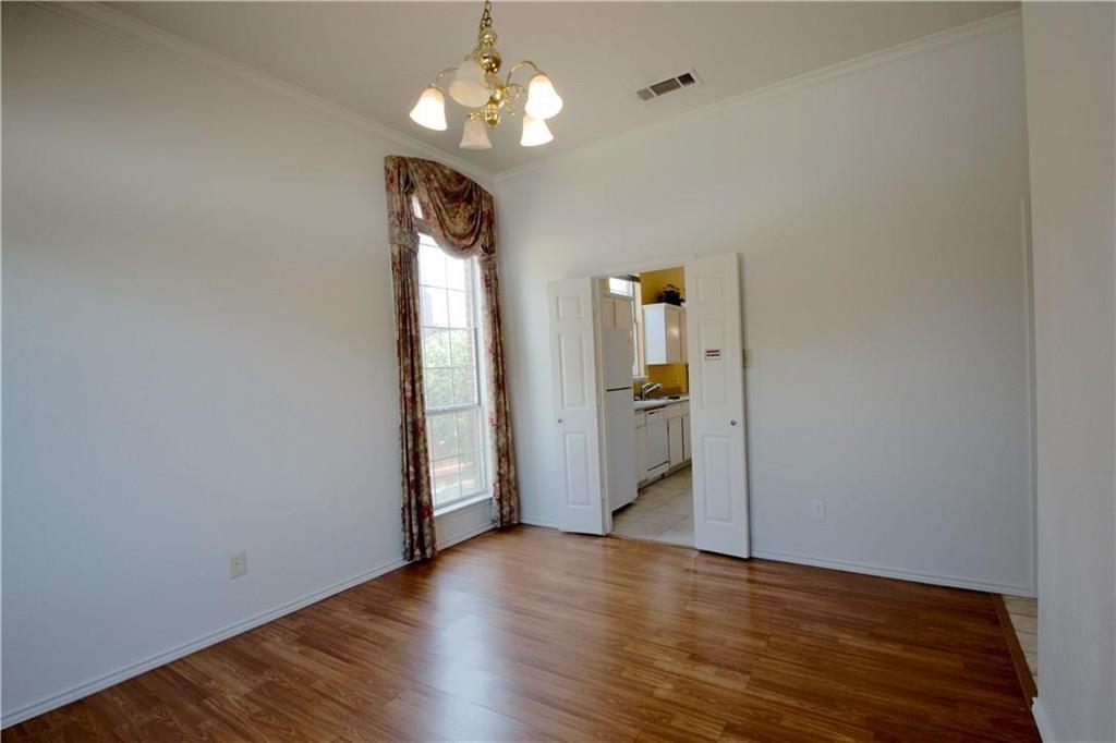 559 Raintree Circle Coppell, TX 75019 - Photo 2 of 18 wooden floor in an empty room with a window