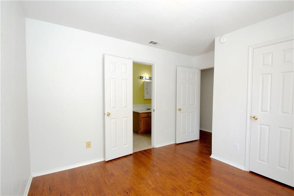 559 Raintree Circle Coppell, TX 75019 - Photo 7 of 18 a view of an empty room with wooden floor