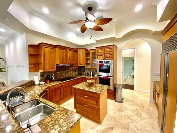 a kitchen that has a lot of furniture in it