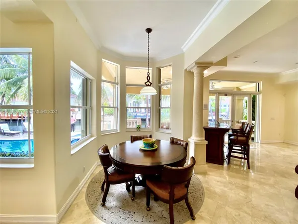 a view of a dining room with furniture and window