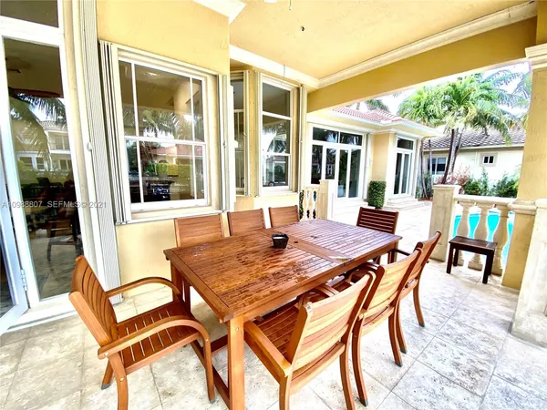 a view of a patio with a table and chairs