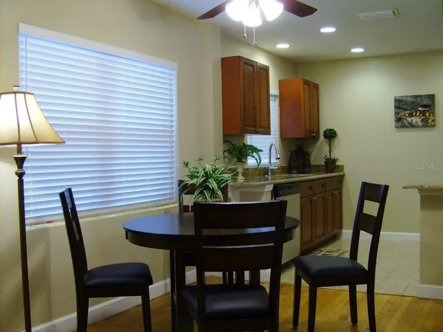 a dining room with furniture and window