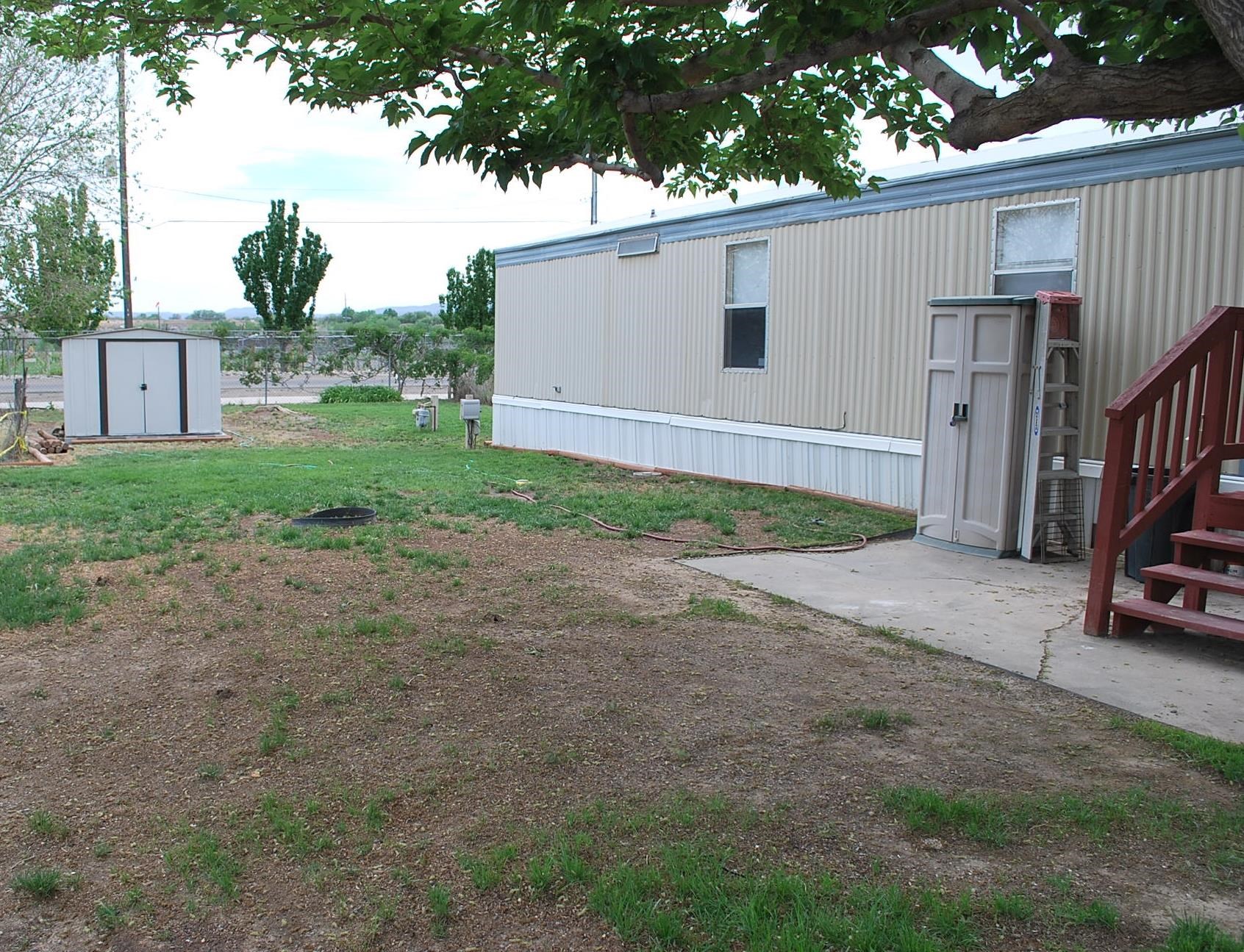 424 32 Road, Unit 168 Clifton, CO 81520 - Photo 14 of 17 a view of a house with backyard and parking area