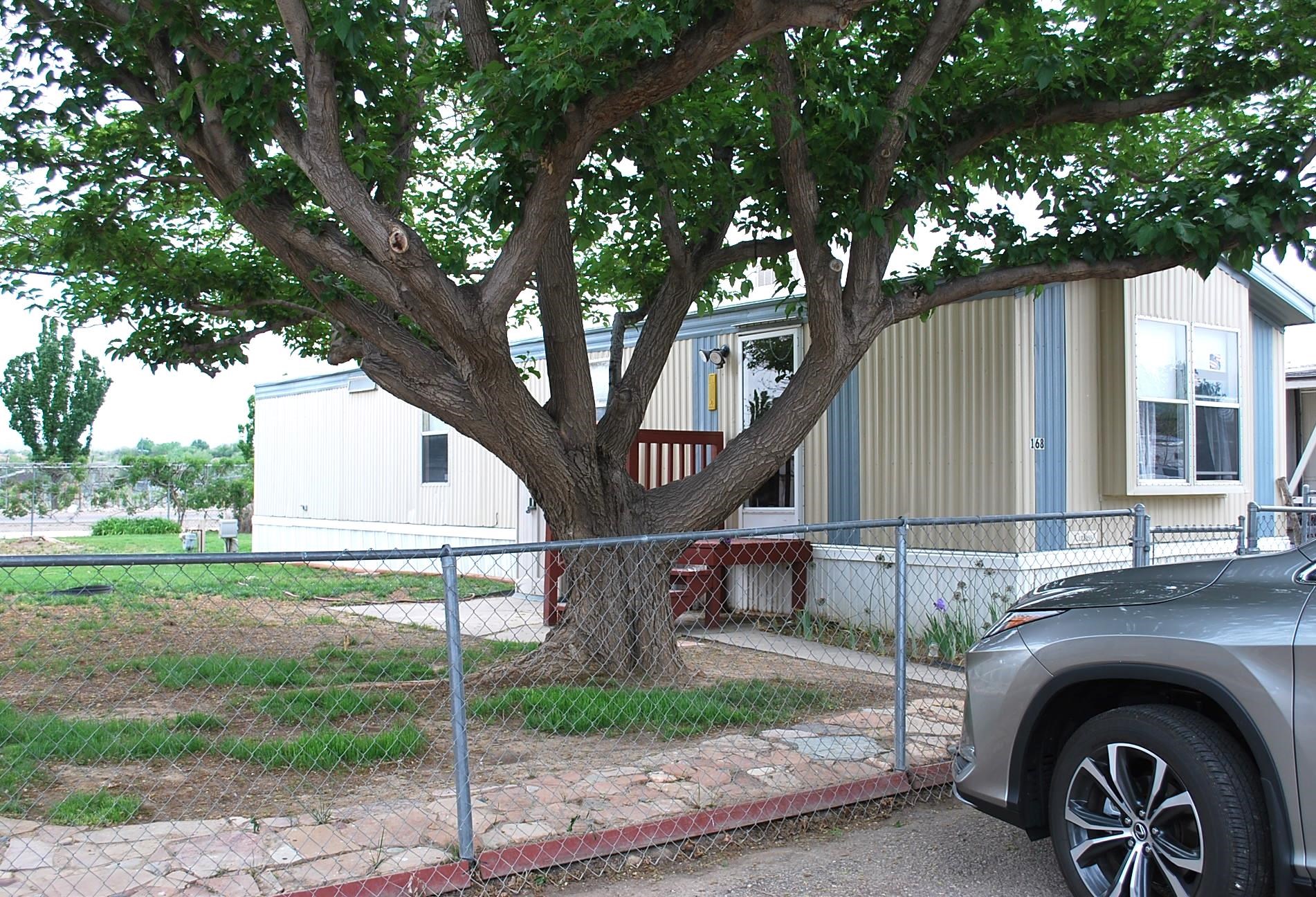 424 32 Road, Unit 168 Clifton, CO 81520 - Photo 16 of 17 a view of a house with a backyard