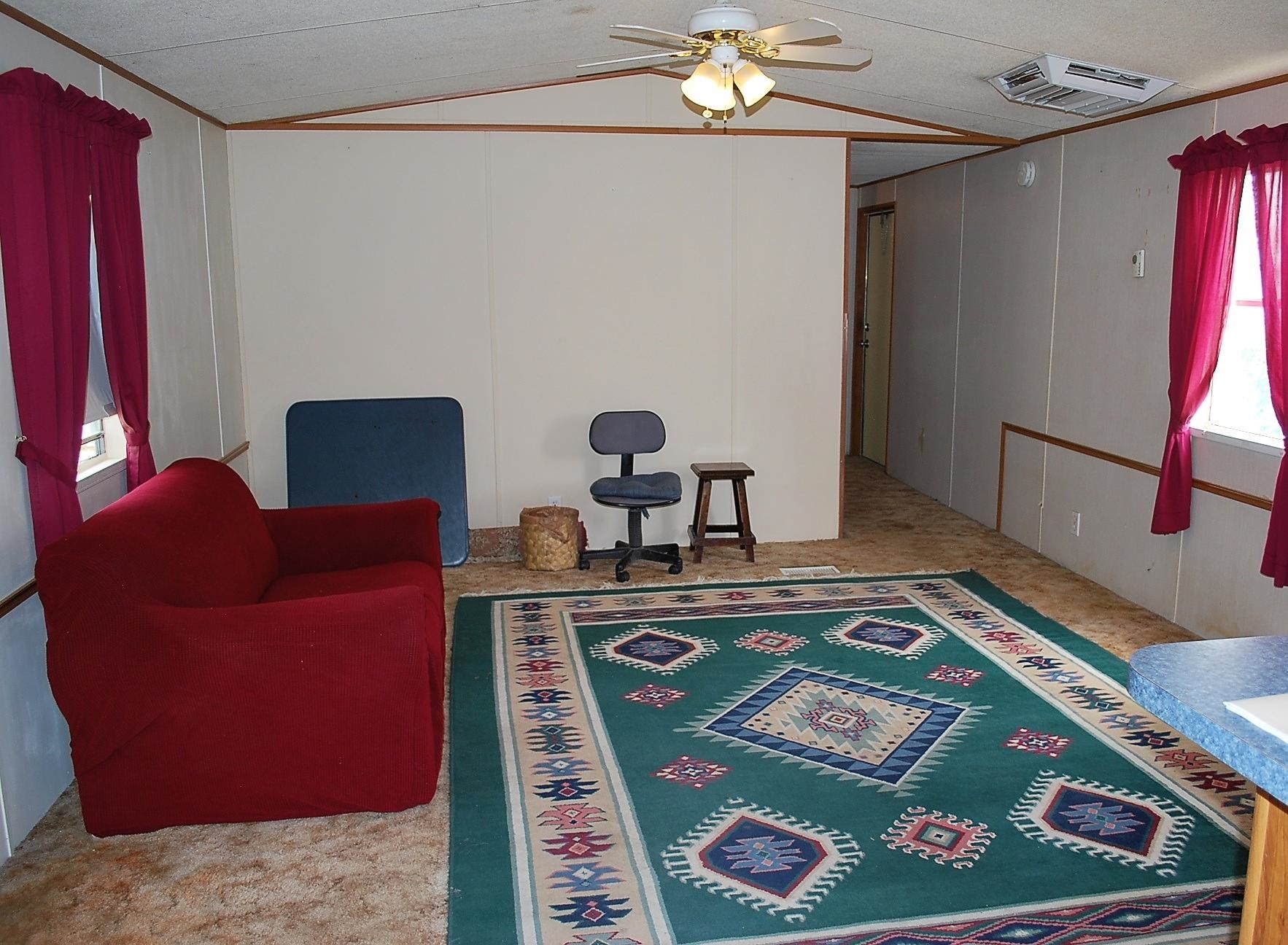 424 32 Road, Unit 168 Clifton, CO 81520 - Photo 2 of 17 a living room with furniture and a chandelier