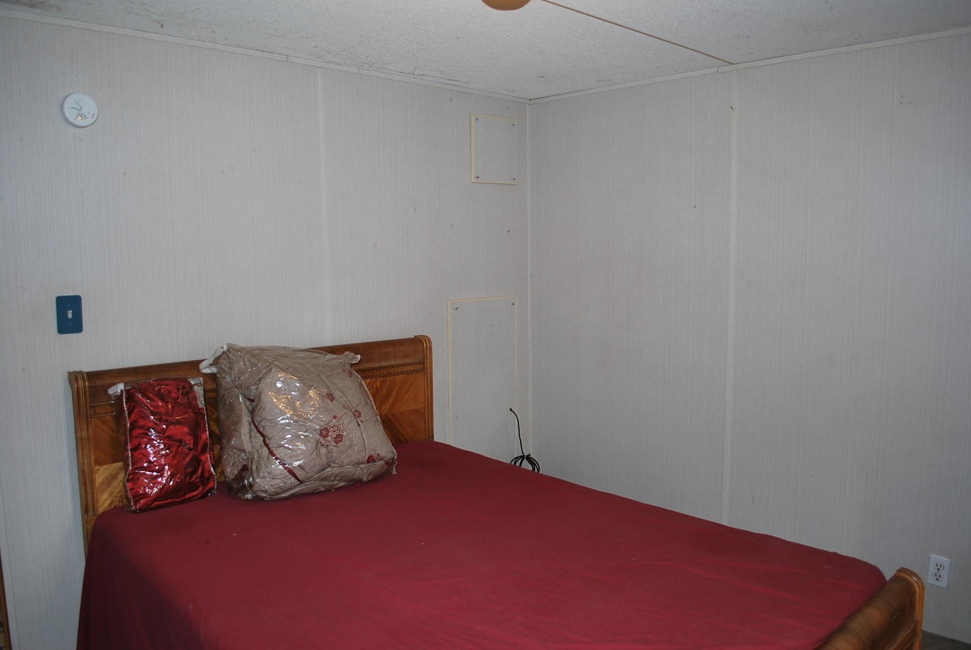 424 32 Road, Unit 168 Clifton, CO 81520 - Photo 9 of 17 a bed sitting in a bedroom next to a white wall