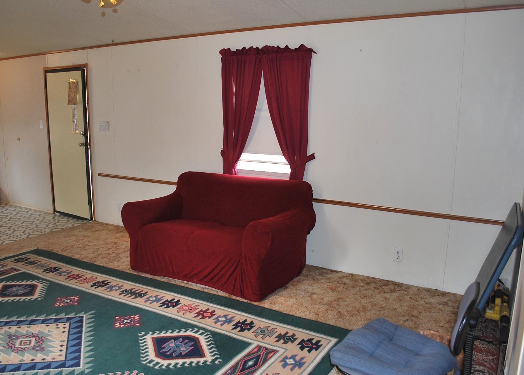 424 32 Road, Unit 168 Clifton, CO 81520 - Photo 10 of 17 a living room with furniture and a wooden floor