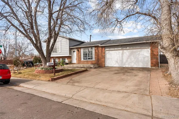 a view of a house with snow on the road