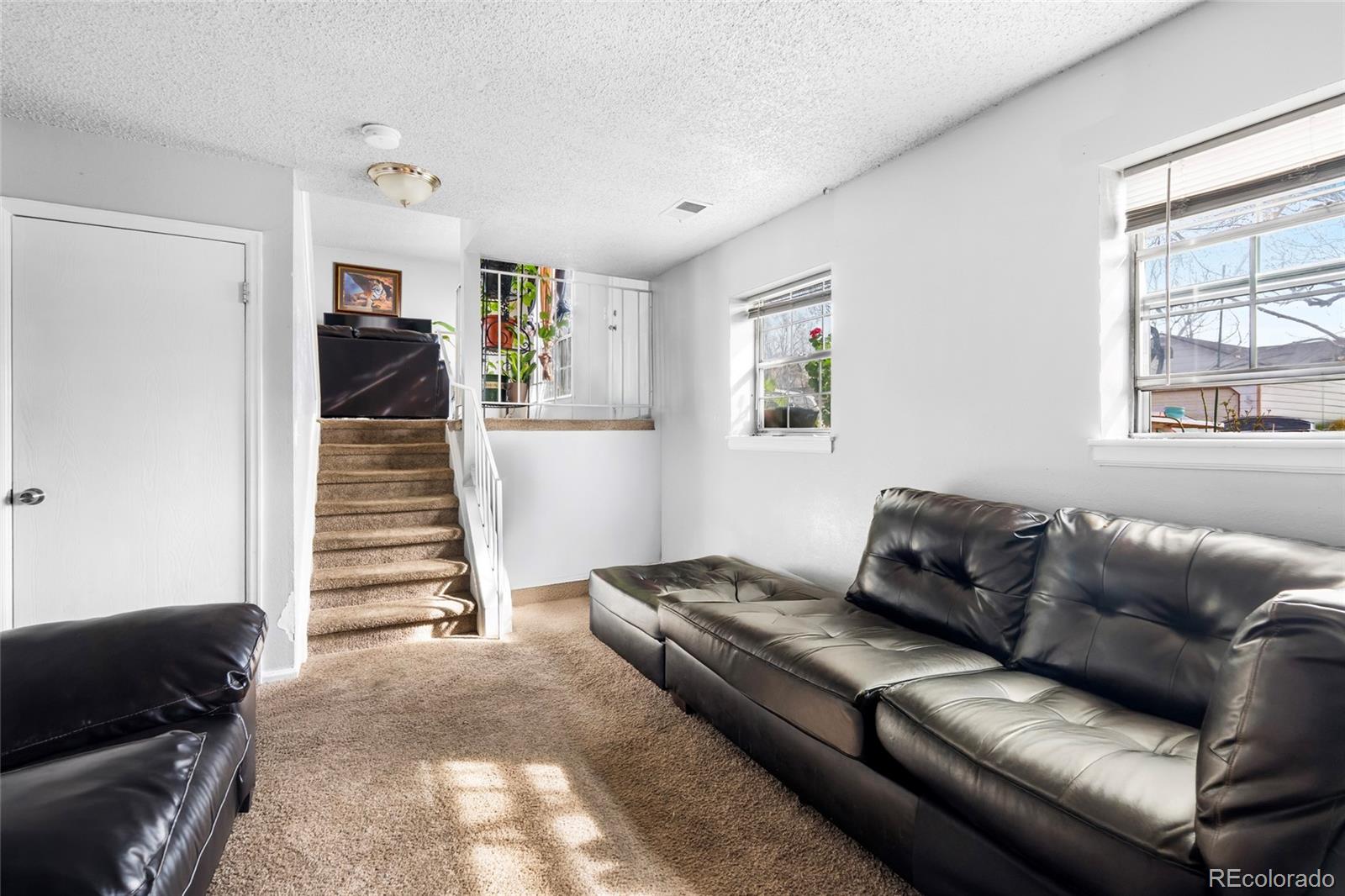 4609 Fontana Way Denver, CO 80239 - Photo 13 of 22 a living room with furniture and wooden floor